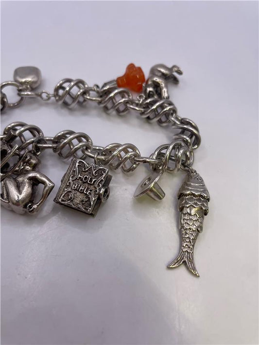 Silver bracelet weighing 73.5 grams with intricate design, unbranded jewelry accessory on a plain background.