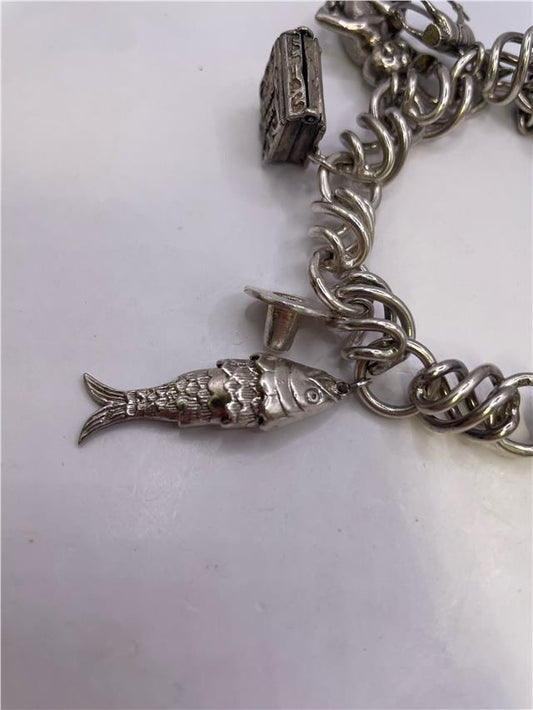 Silver bracelet weighing 73.5 grams with a sleek, polished finish, featuring a simple, elegant design.