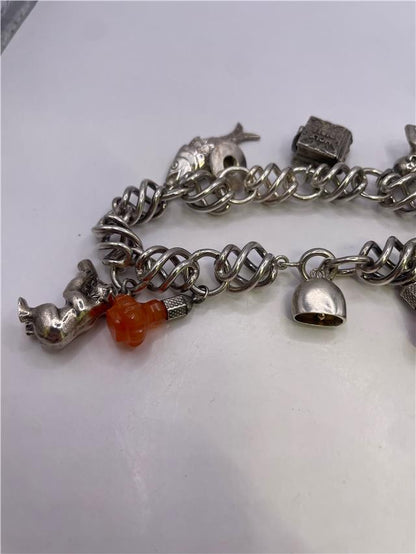 Silver bracelet weighing 73.5 grams with a sleek design, featuring smooth metal links and a polished finish.