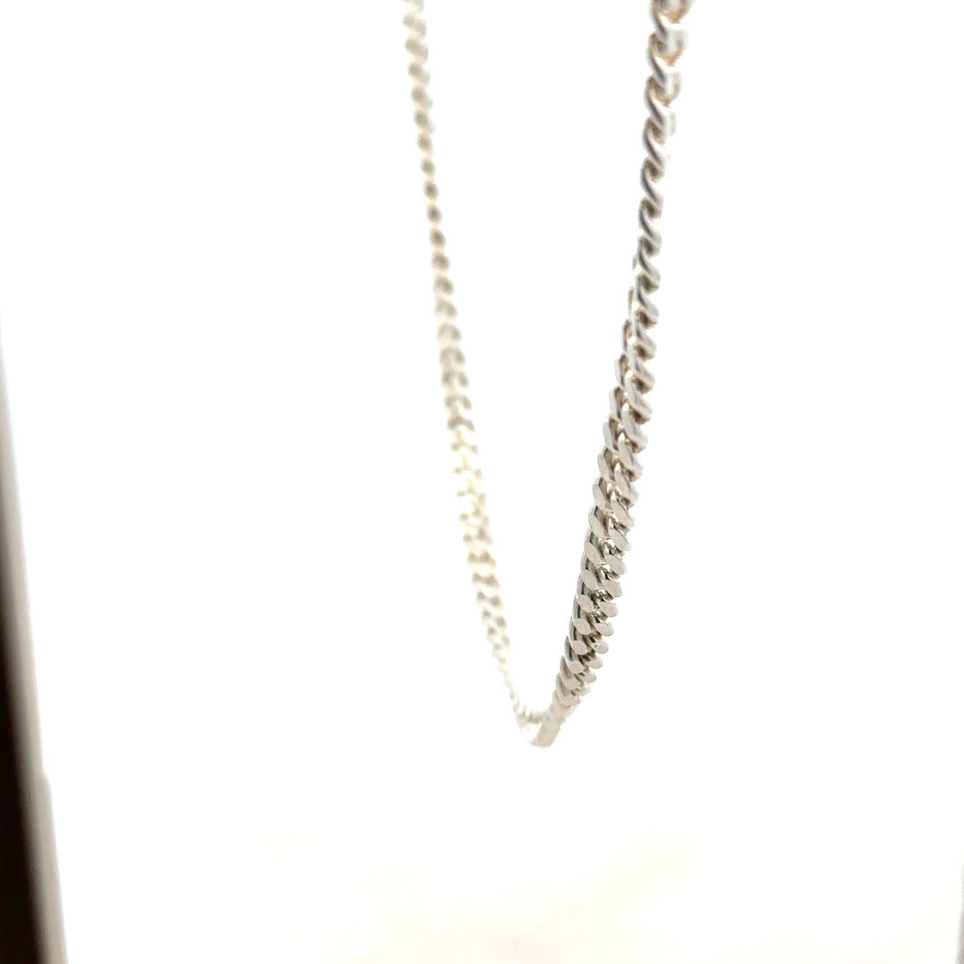Silver chain weighing 24.9g with a sleek, polished finish, showcasing its elegant design and sturdy link construction.
