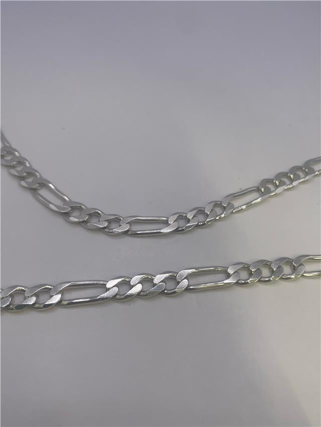 Silver chain weighing 31.5g, featuring a sleek, unbranded design with a classic link style.