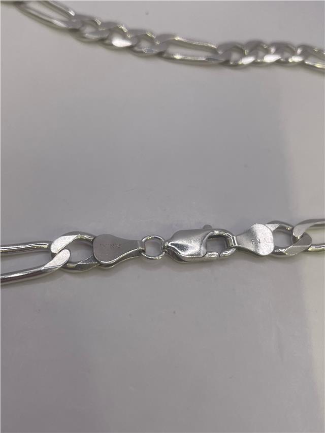 Silver chain weighing 31.5g, crafted with a smooth link design, perfect for stylish jewelry or accessory wear.