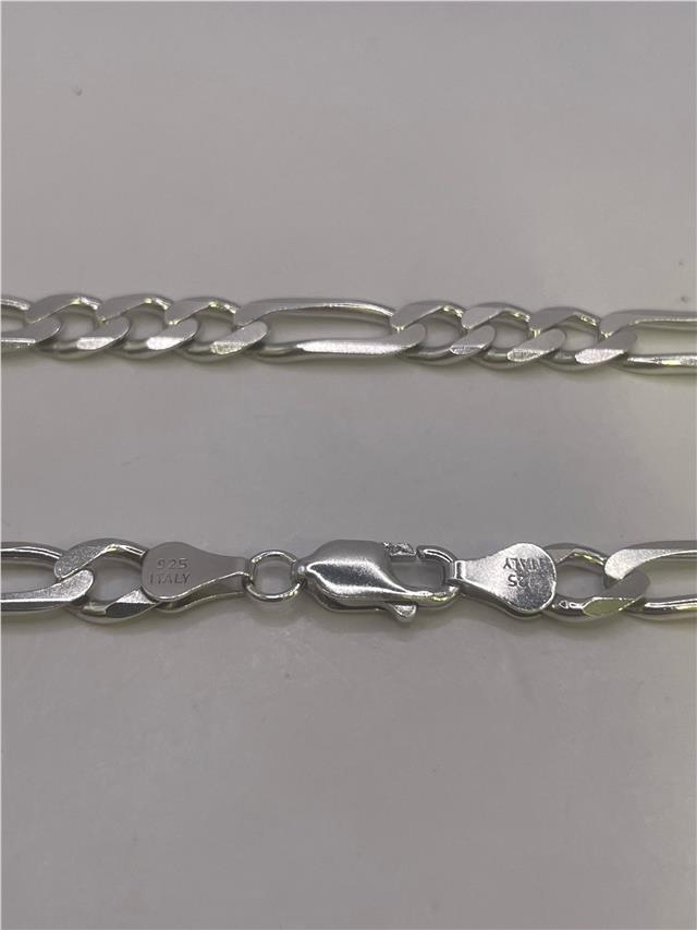 Silver chain weighing 31.5g with intricate link design, unbranded jewelry accessory, shown on a plain background.
