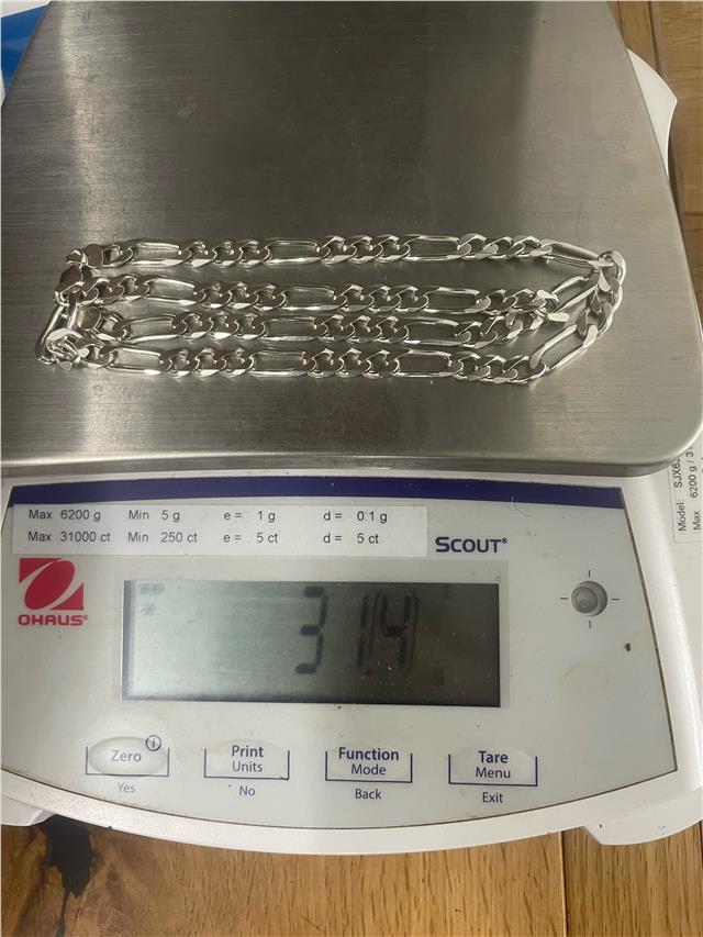 Silver chain weighing 31.5g with a sleek design, featuring a classic link style and a polished finish.