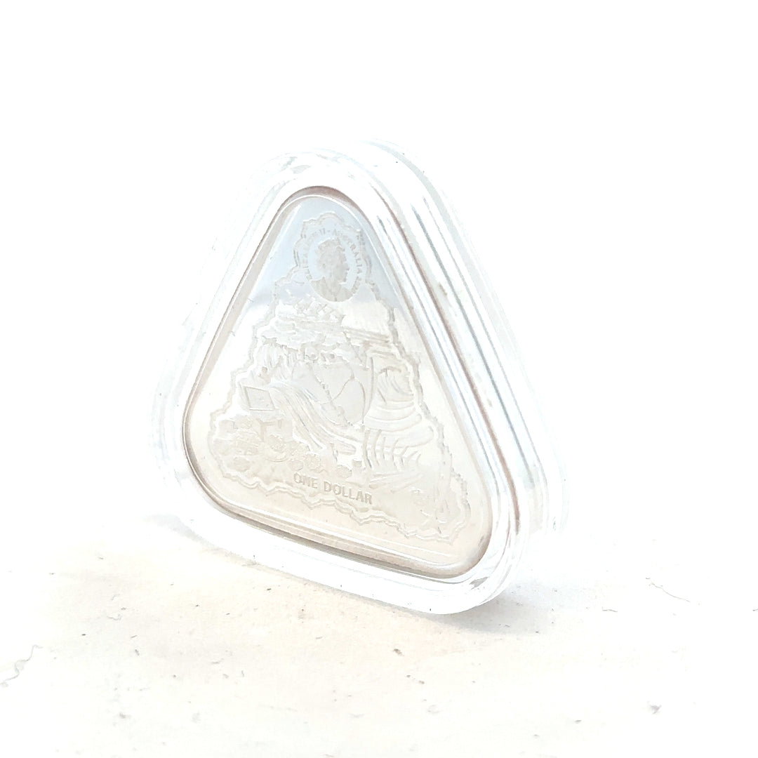 Silver coin weighing 31.8g, unbranded, with detailed surface design and a shiny metallic finish.