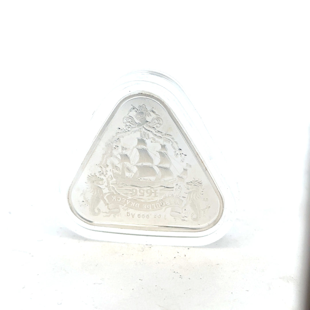 Silver coin weighing 31.8g with detailed engravings, unbranded, featuring intricate designs visible on the coin's surface.
