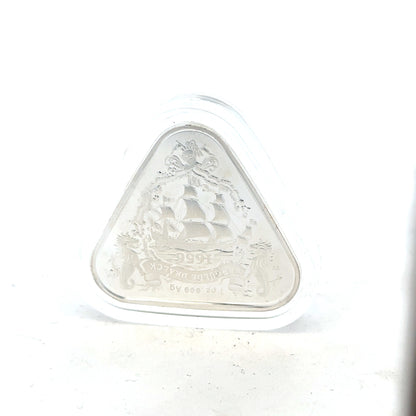 Silver coin weighing 31.8g with detailed engravings, unbranded, featuring intricate designs visible on the coin's surface.