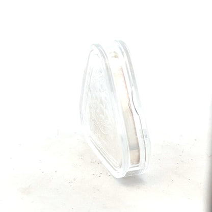 Silver coin weighing 31.8g with detailed design, unbranded, shown from a clear front view in the image.