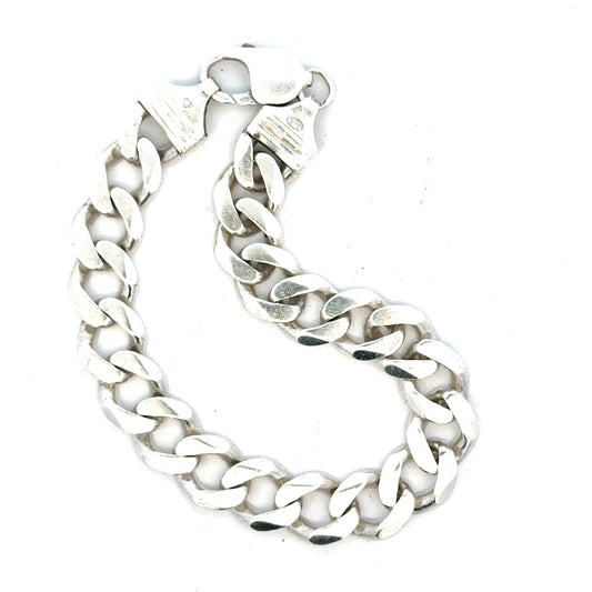 Silver curb bracelet weighing 33.7g with a sleek design, featuring interconnected links, ideal for stylish jewelry collection.
