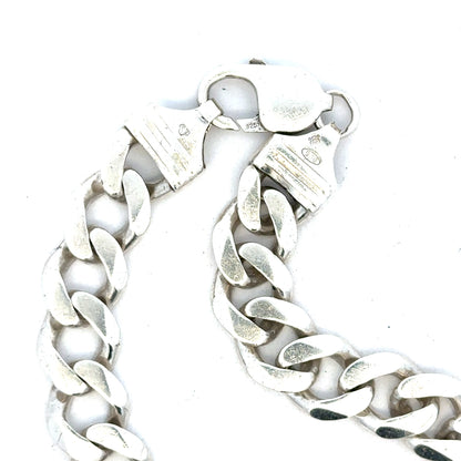 Silver curb bracelet weighing 33.7g, unbranded jewelry with a sleek, polished chain design, shown in a close-up image.