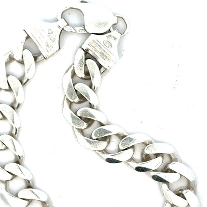 Silver curb bracelet weighing 33.7g with linked chain design, unbranded, displayed on a neutral background.