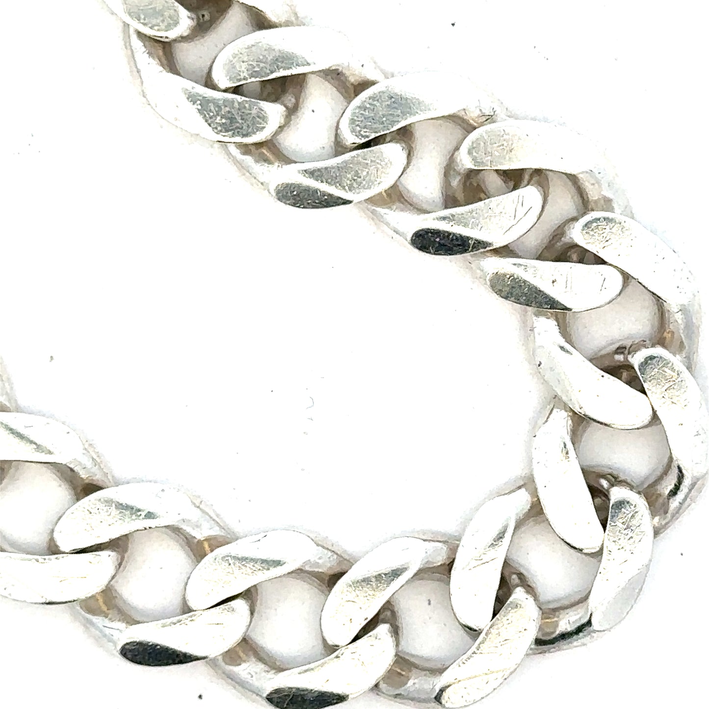 Silver curb bracelet weighing 33.7g, featuring classic linked chain design, unbranded jewelry accessory.