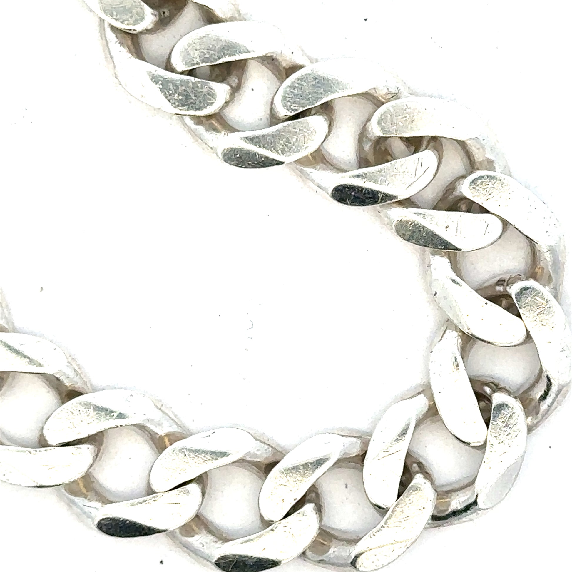 Silver curb bracelet weighing 33.7g, featuring classic linked chain design, unbranded jewelry accessory.