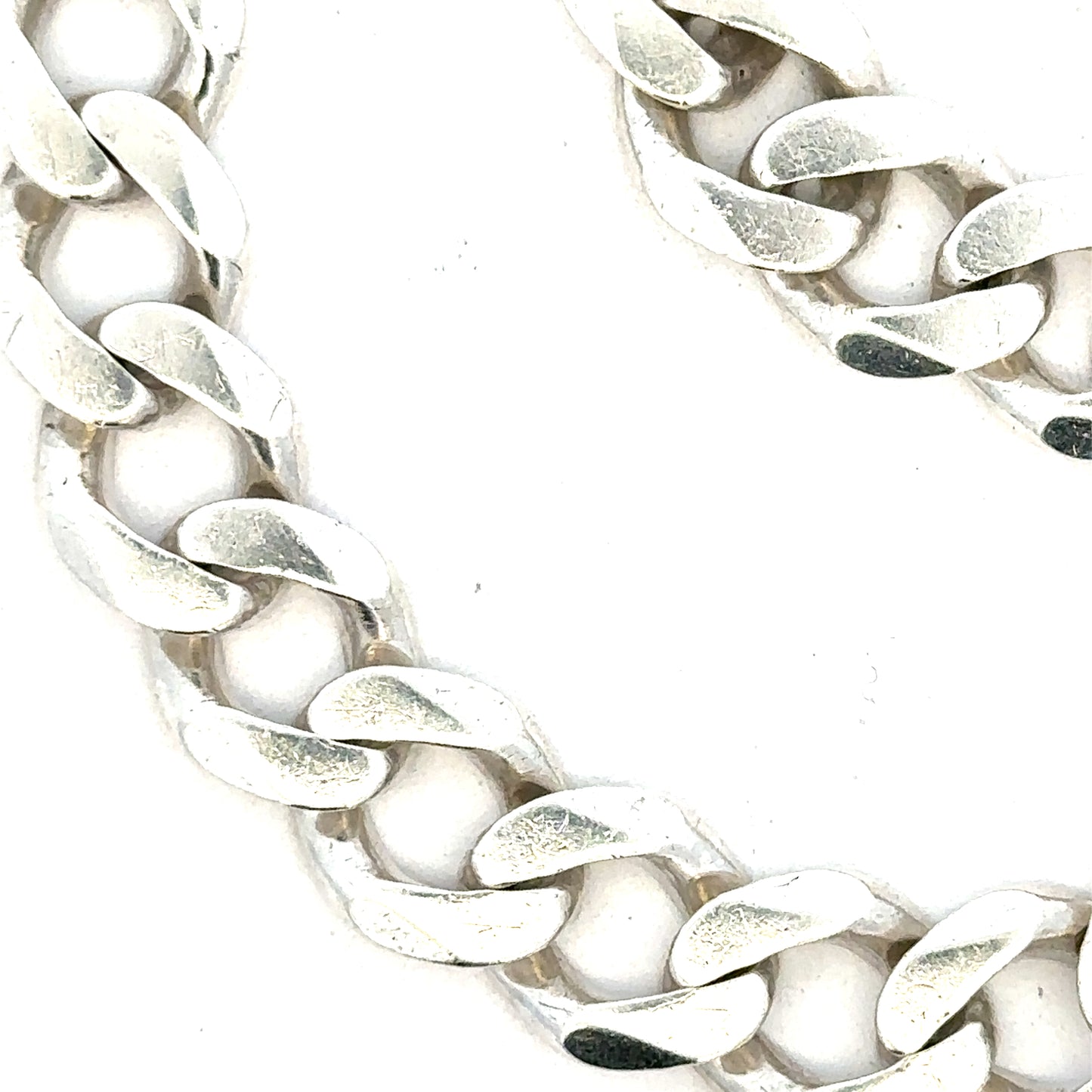 Silver curb bracelet weighing 33.7g, unbranded, showcasing a sleek chain design with polished links.