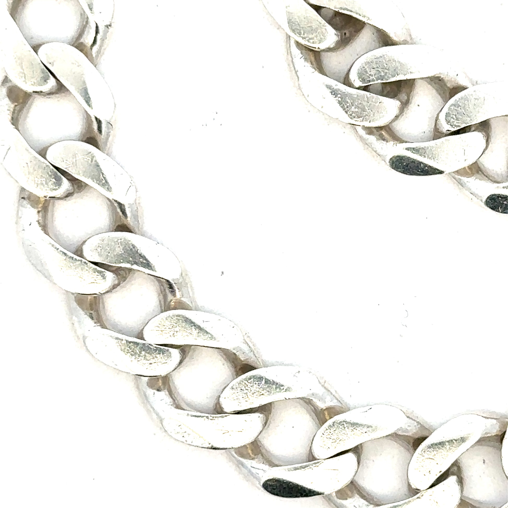 Silver curb bracelet weighing 33.7g, unbranded, showcasing a sleek chain design with polished links.
