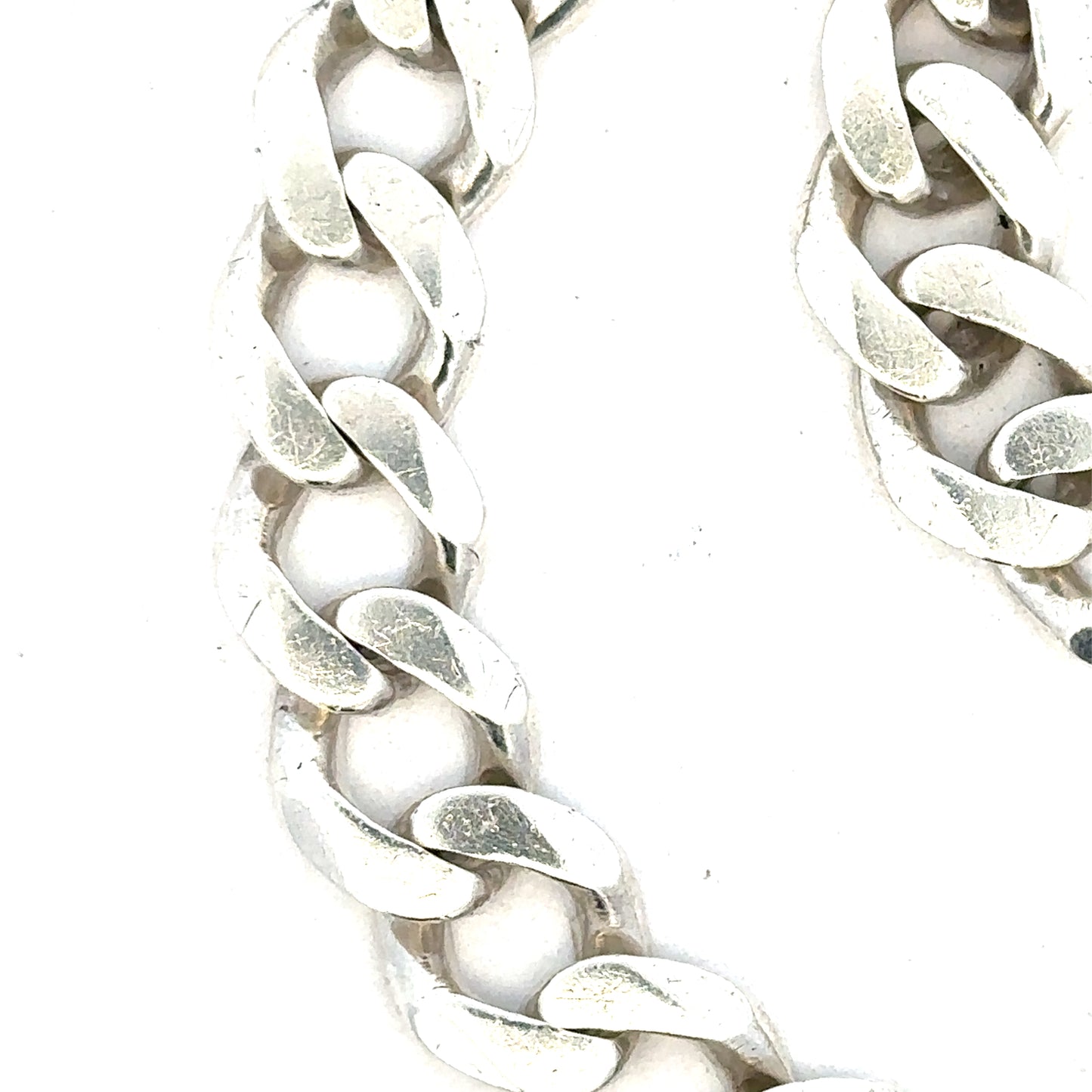 Silver curb bracelet weighing 33.7g with a sleek, chain-link design, perfect for stylish accessories.