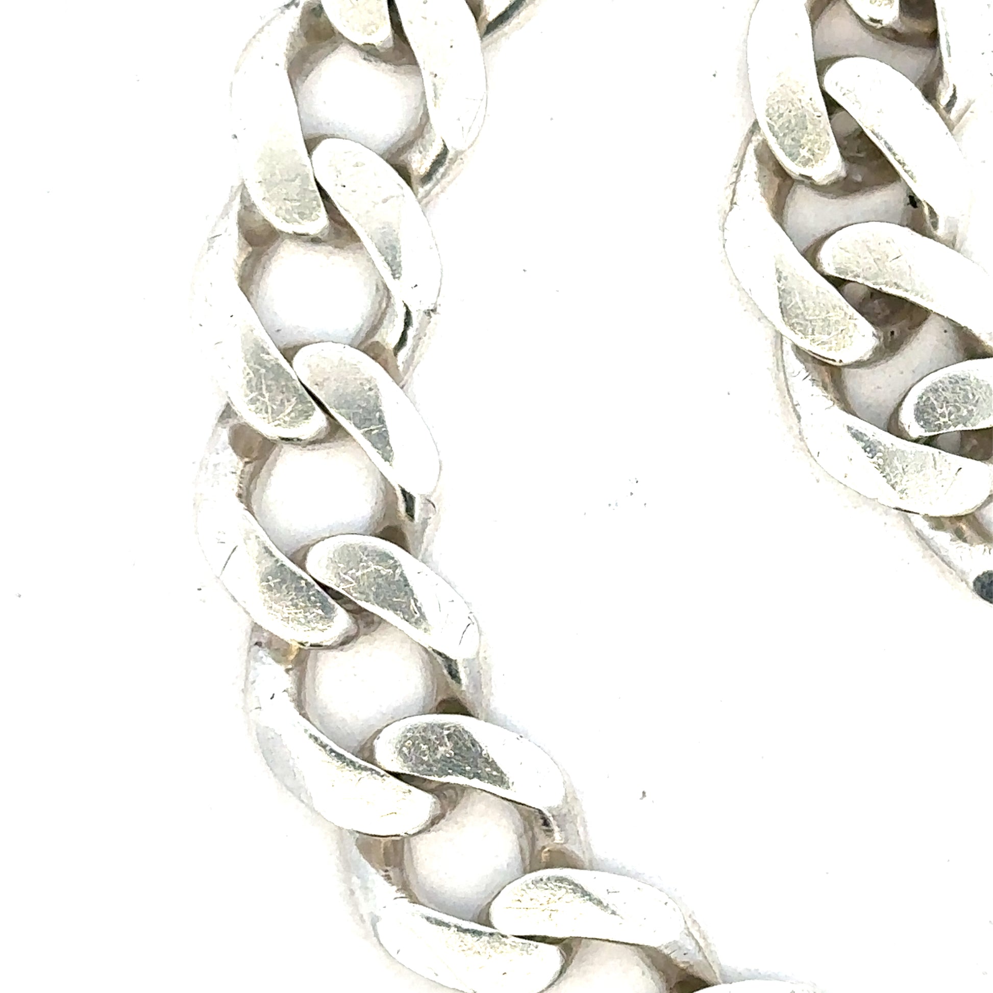 Silver curb bracelet weighing 33.7g with a sleek, chain-link design, perfect for stylish accessories.