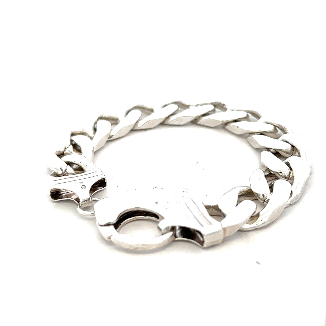 Silver curb bracelet weighing 81.4g with a sleek, interlinked chain design, unbranded, shown against a neutral background.