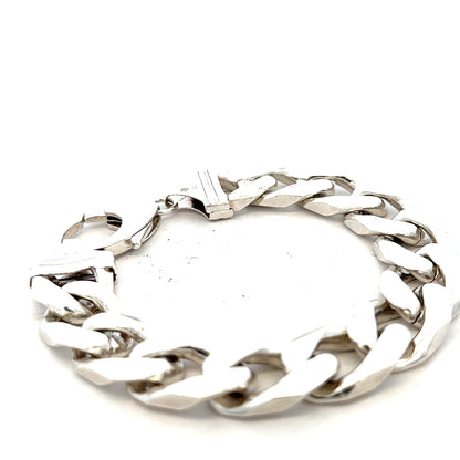 Silver curb bracelet weighing 81.4g, unbranded, featuring a classic chain design with polished links.