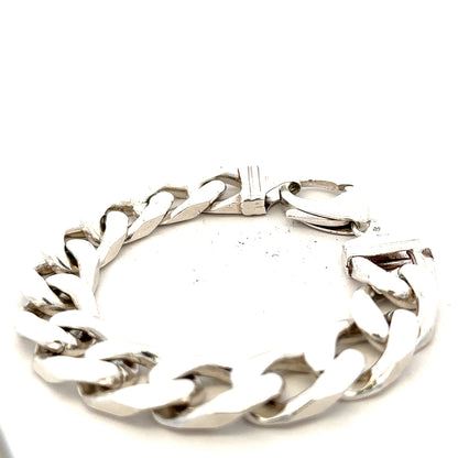 Silver curb bracelet weighing 81.4g, featuring a sleek, linked chain design, perfect for casual or elegant wear.