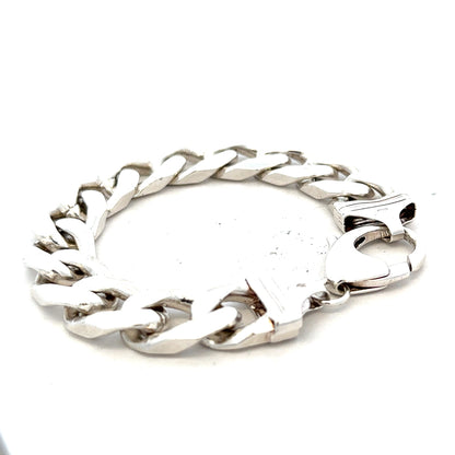 Silver curb bracelet weighing 81.4g, featuring a sleek chain design, displayed in a natural pose.
