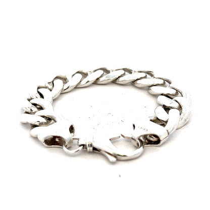 Silver curb bracelet weighing 90.1g with a sleek chain design, featuring a shiny, polished finish.