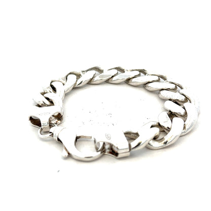 Silver curb bracelet weighing 90.1g with a sleek, polished design, featuring interconnected links and a secure clasp.