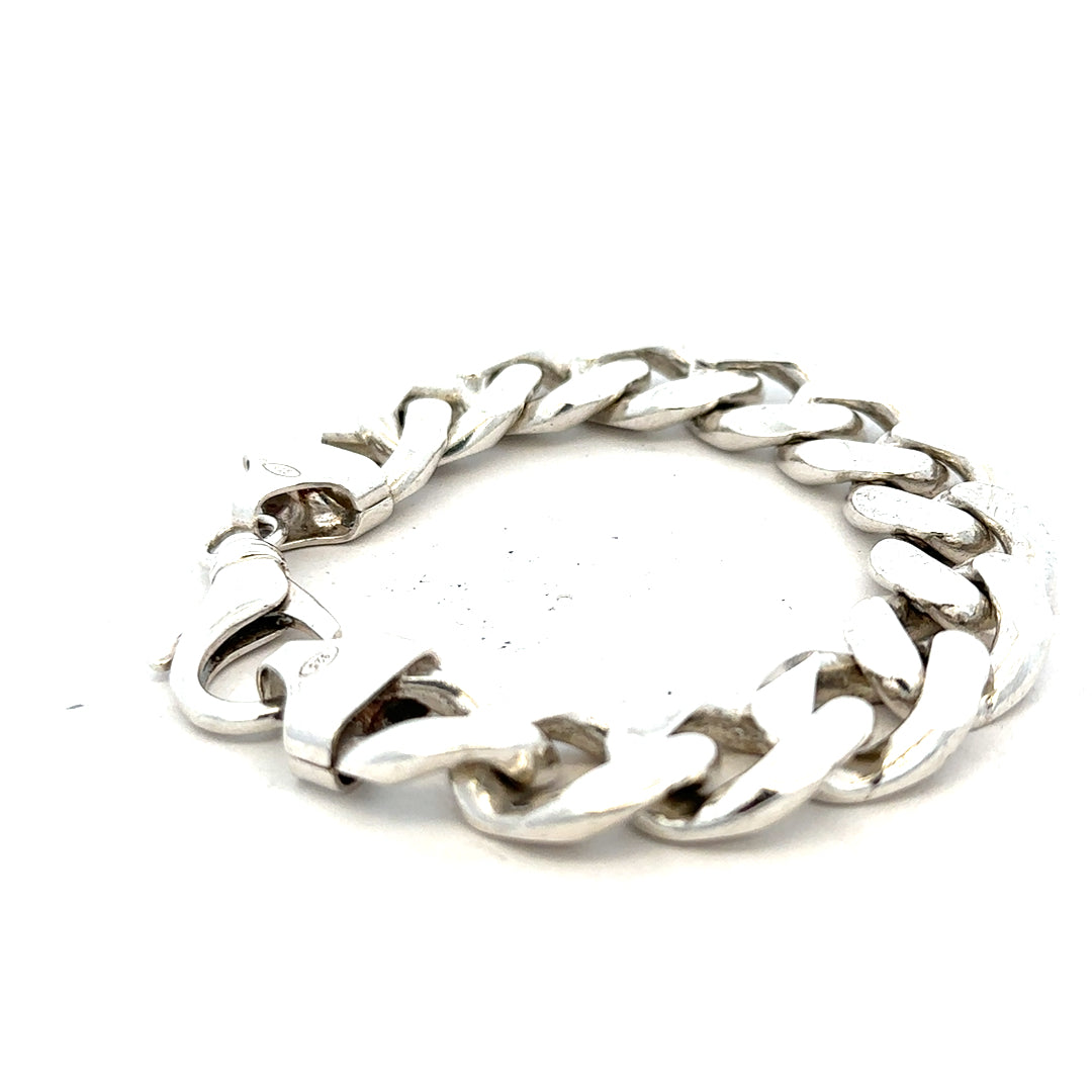 Silver curb bracelet weighing 90.1g, featuring a sleek chain design, unbranded jewelry piece with detailed links.