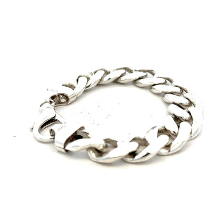 Silver curb bracelet weighing 90.1g, featuring a sleek chain design, unbranded jewelry piece with detailed links.