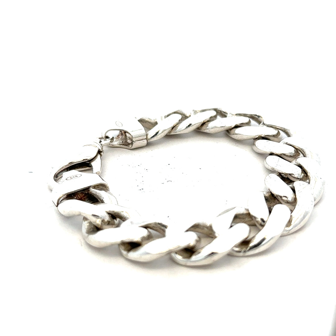 Silver curb bracelet weighing 90.1g with a sleek chain design, showcasing shiny silver links.