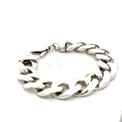 Silver curb bracelet weighing 90.1g with a sleek, interconnected chain design, unbranded jewelry accessory.