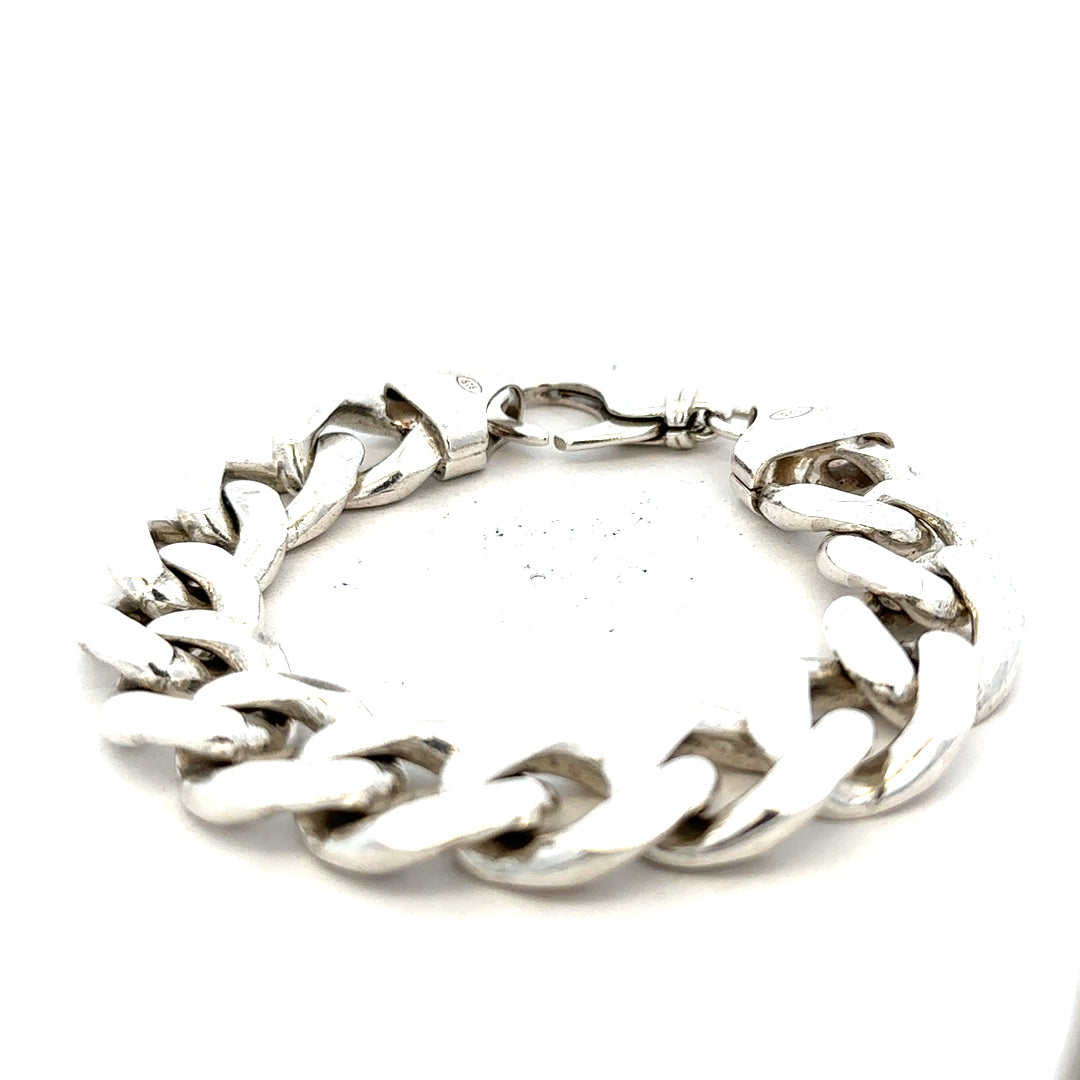 Silver curb bracelet weighing 90.1g with linked chain design, unbranded jewelry piece in silver metal.