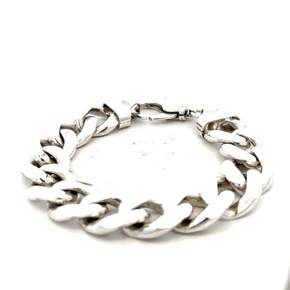 Silver curb bracelet weighing 90.1g with linked chain design, unbranded jewelry piece in silver metal.