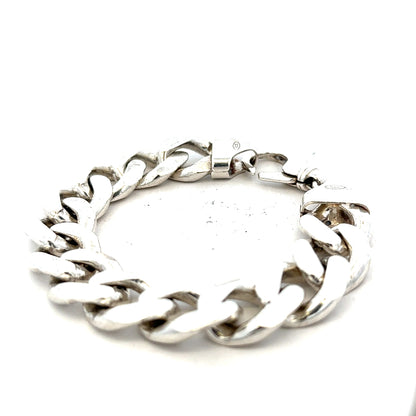 Silver curb bracelet weighing 90.1g with a polished finish, featuring interlocking chain links, unbranded jewelry accessory.