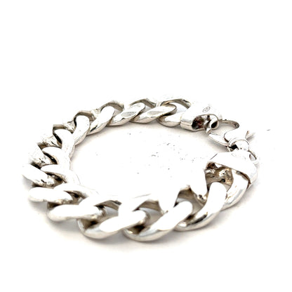 Silver curb bracelet weighing 90.1g, showcasing a sleek chain design with a polished finish.