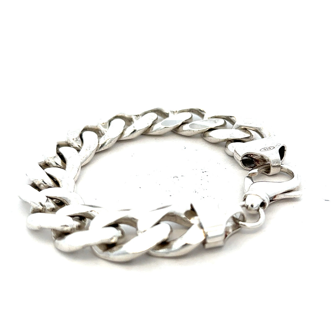 Silver curb bracelet weighing 90.1g with a classic chain link design, unbranded jewelry shown on a neutral background.