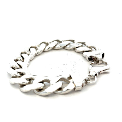Silver curb bracelet weighing 90.1g with a classic chain link design, unbranded jewelry shown on a neutral background.