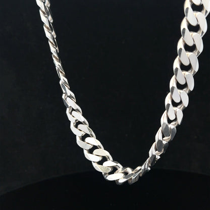 Silver curb chain weighing 109.9g, featuring a classic link design, perfect for jewelry or accessories.