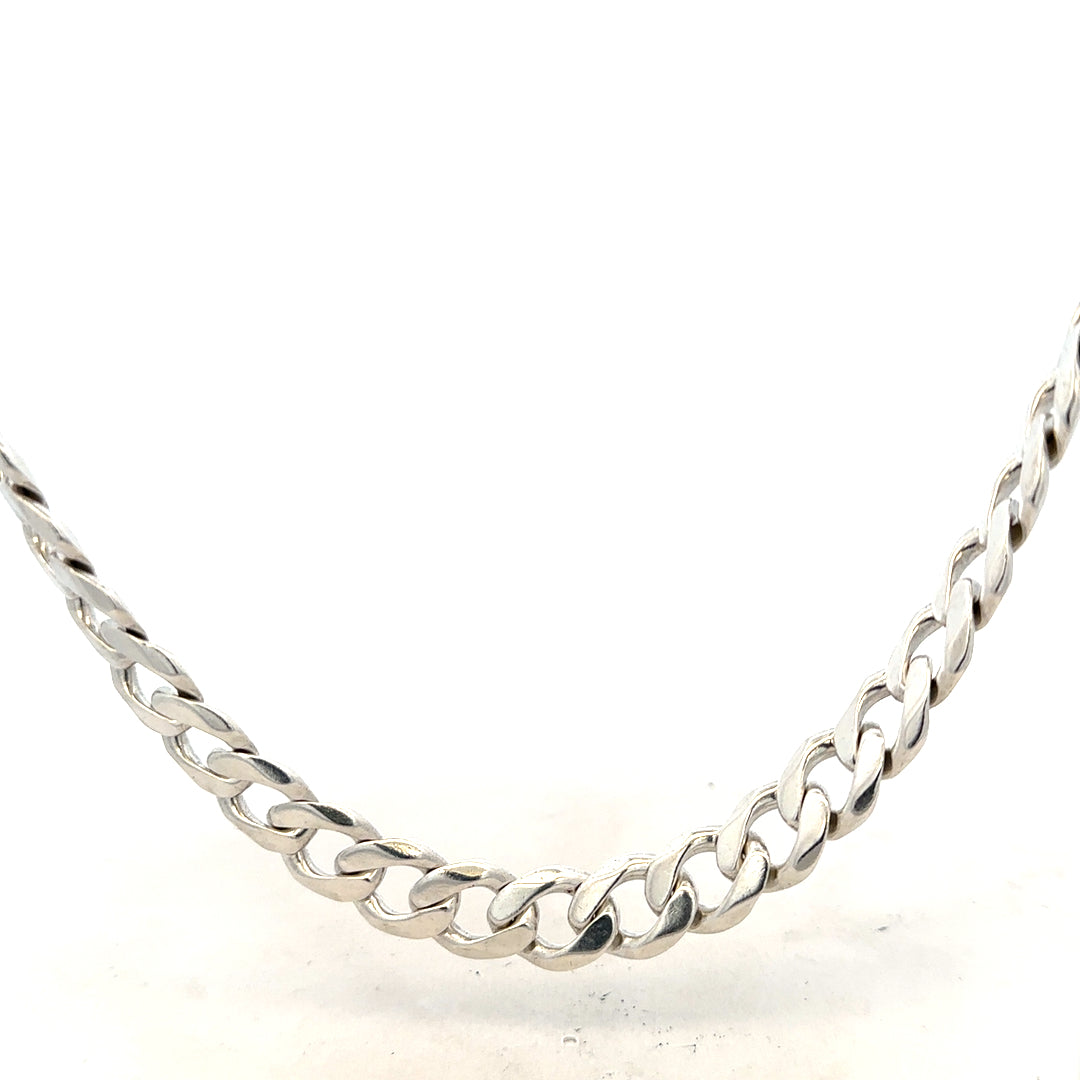 Silver curb chain weighing 115.4g, featuring a classic linked design, ideal for jewelry or accessory use.