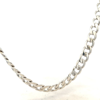 Silver curb chain weighing 115.4g, featuring interlinked oval links, designed for jewelry and style accessories.