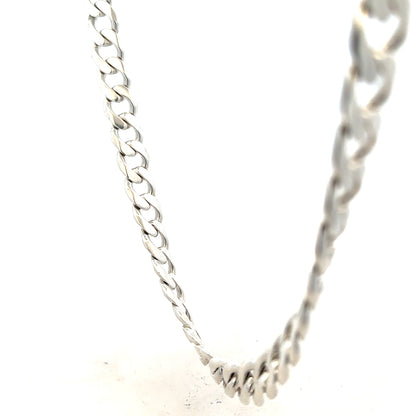 Silver curb chain weighing 115.4g, featuring a classic design with interlocking links, unbranded jewelry accessory.