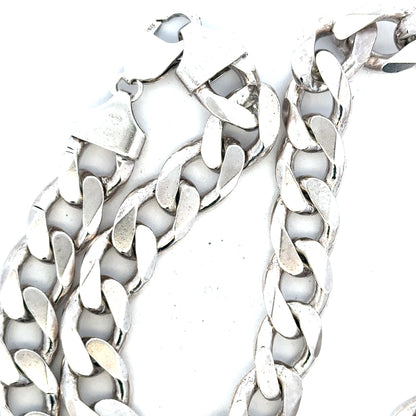 Silver curb chain weighing 134.5g, featuring a classic design with interlocking links, perfect for jewelry or accessories.