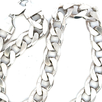 Silver curb chain weighing 134.5g, unbranded jewelry chain with a sleek, classic design and polished finish.