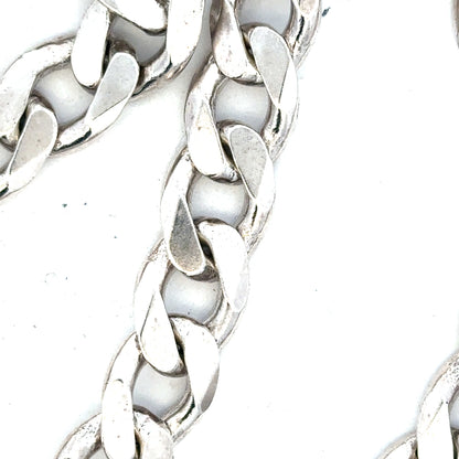 Silver curb chain weighing 134.5g, featuring a classic linked design, perfect for jewelry or accessory styling.