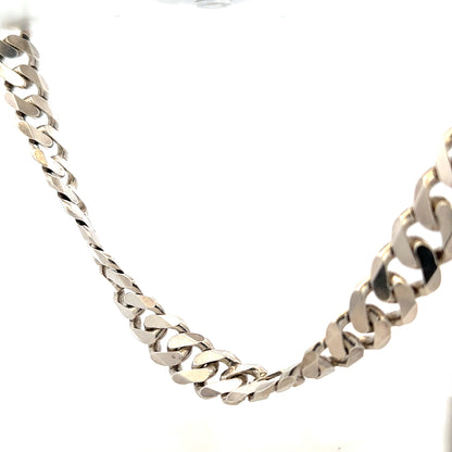 Silver curb chain weighing 148.4g, featuring a classic design with interconnected oval links, ideal for jewelry or fashion accessories.