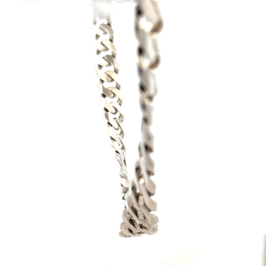 Silver curb chain weighing 148.4g, featuring classic linked design, perfect for jewelry making or wearing as a statement accessory.