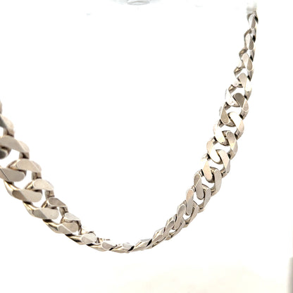 Silver curb chain weighing 148.4g, featuring a classic design with interlocking links, suitable for jewelry or accessories.