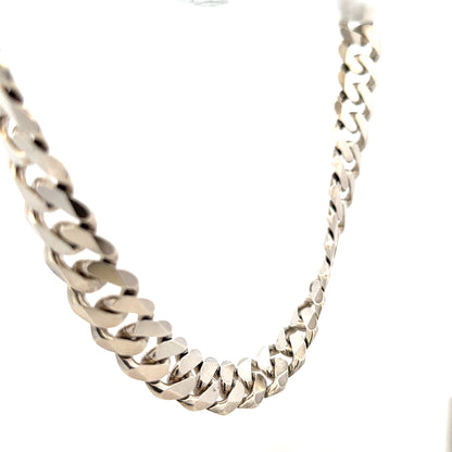 Silver curb chain weighing 148.4g, featuring a classic linked design, suitable for jewelry or fashion accessories.