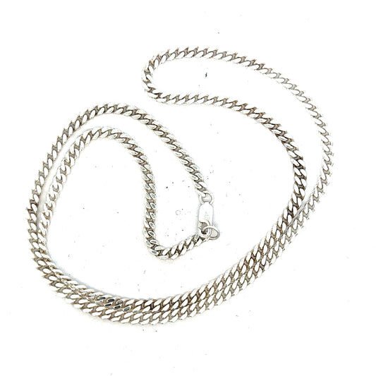 Silver curb chain weighing 24.8g, featuring classic interlinked design, perfect for jewelry or accessories.