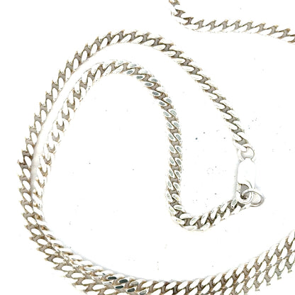 Silver curb chain weighing 24.8g, featuring a classic design with interlocking links, perfect for jewelry accessories.